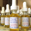 512organics several bottles of Lavish Lavender eye serum on tablecloth